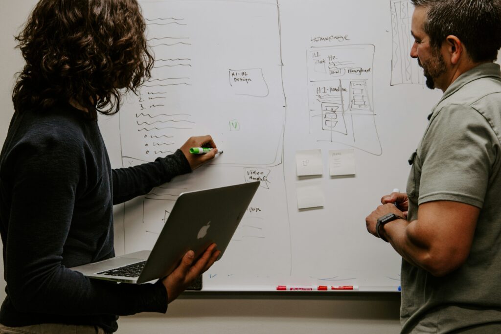 A team evaluates an RFP submission with a whiteboard.