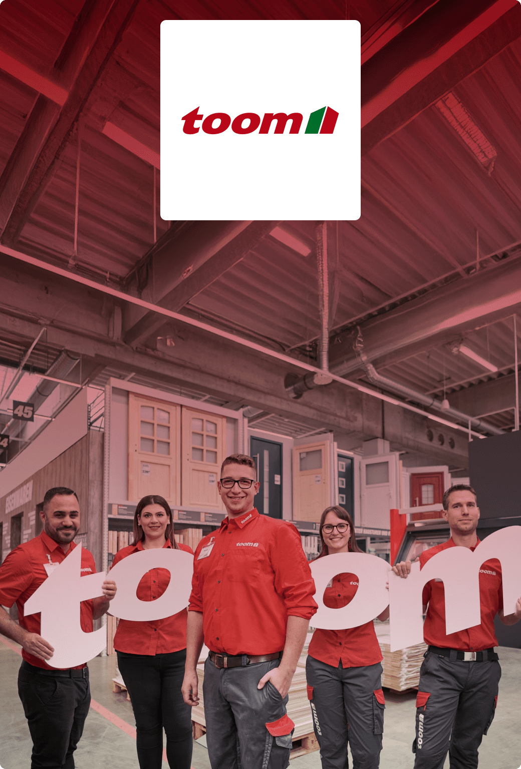 Toom team members hold up letters spelling the company's name.